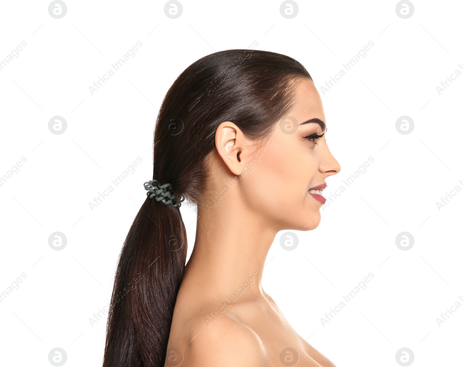 Photo of Young woman with beautiful makeup on white background. Professional cosmetic products