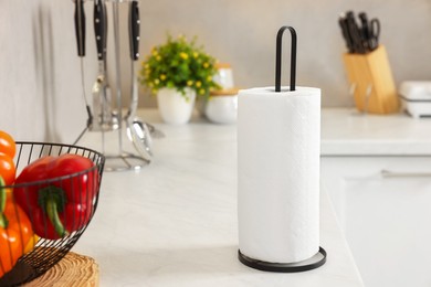 Photo of Roll of paper towels on white countertop in kitchen