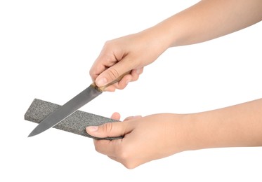 Photo of Woman sharpening knife on white background, closeup