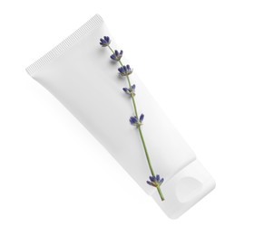 Tube of hand cream and lavender on white background, top view