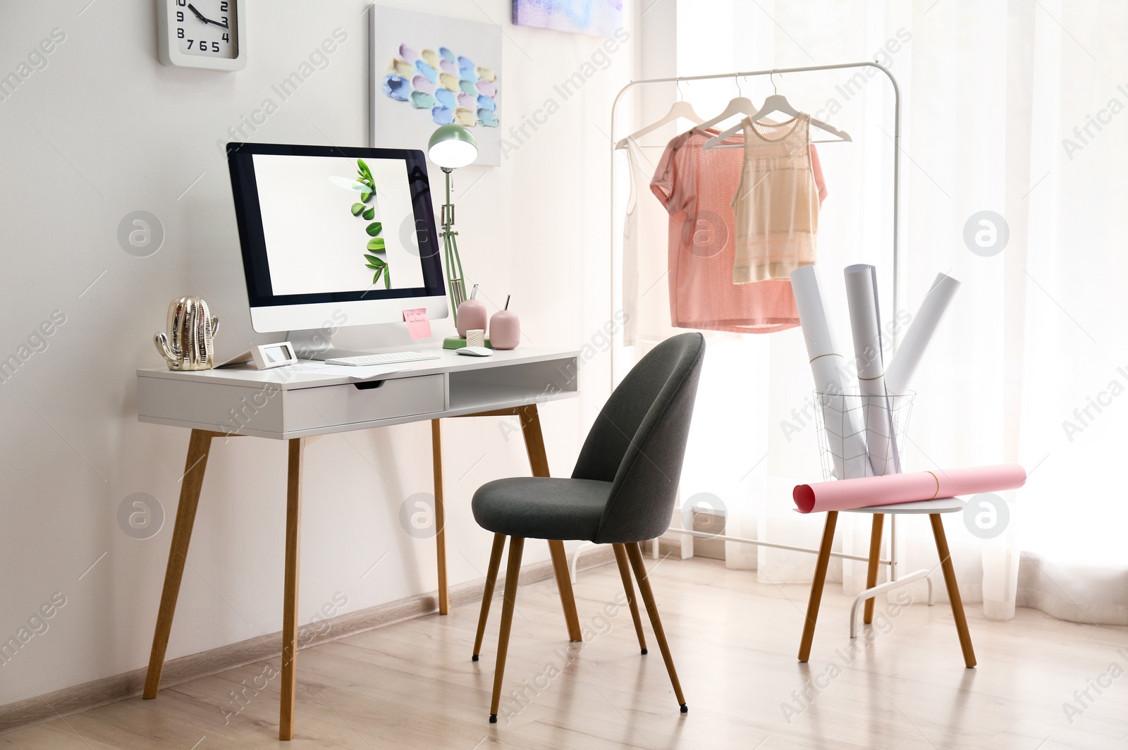 Photo of Designer's workplace with modern computer on table