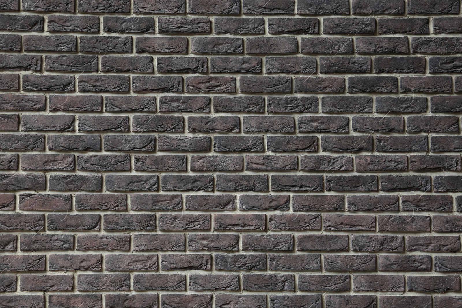 Photo of Texture of brown brick wall as background, closeup