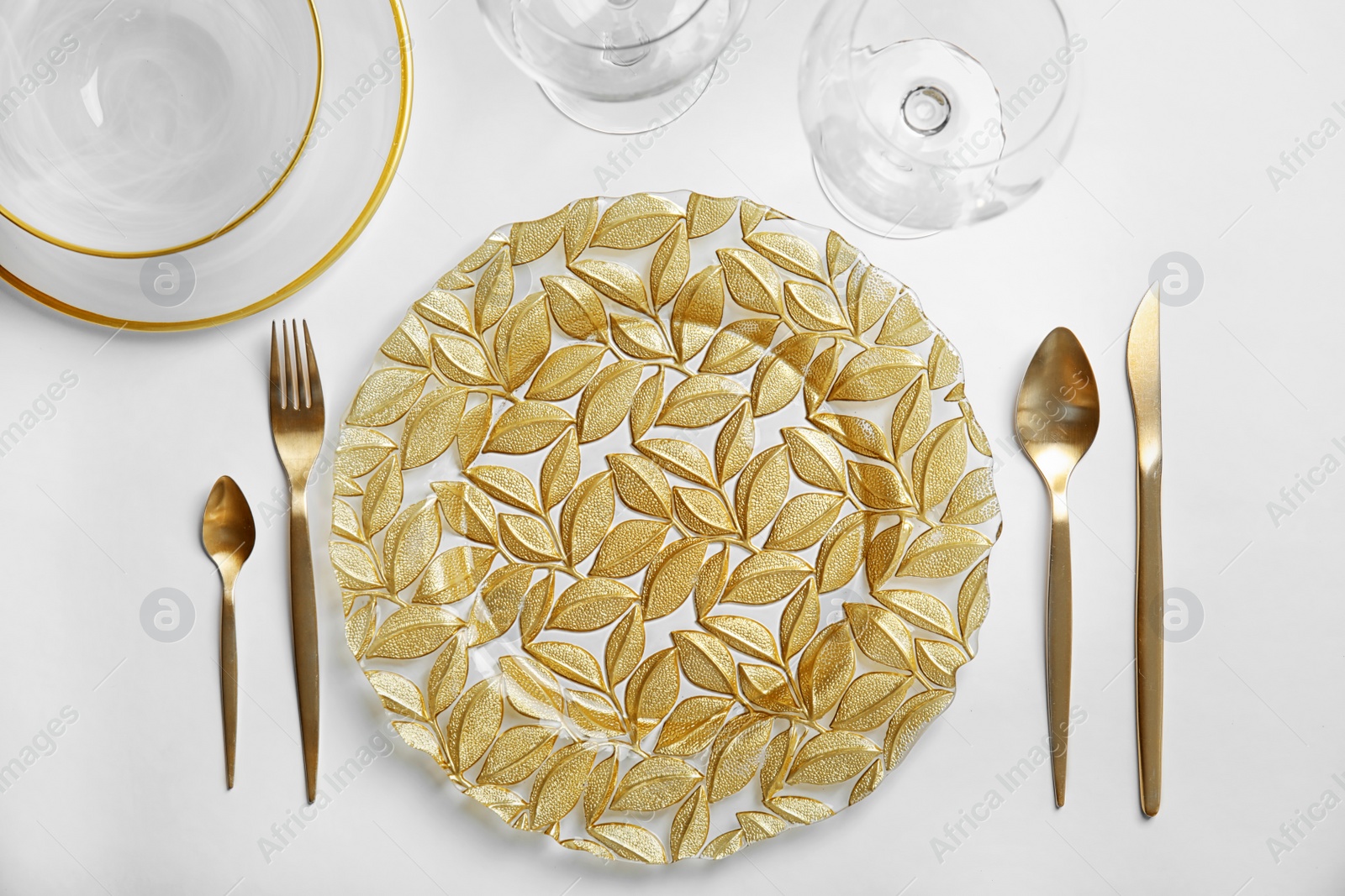 Photo of Elegant table setting on light background, top view