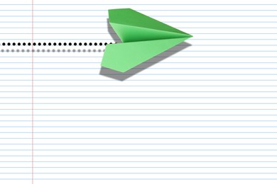 Image of Handmade paper plane on exercise book page