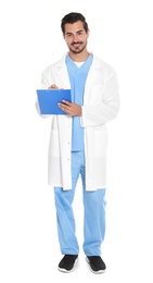 Young male doctor in uniform with clipboard on white background. Medical service