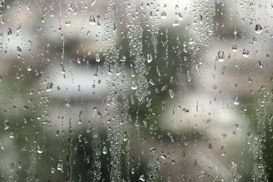 Window glass with raindrops as background, closeup