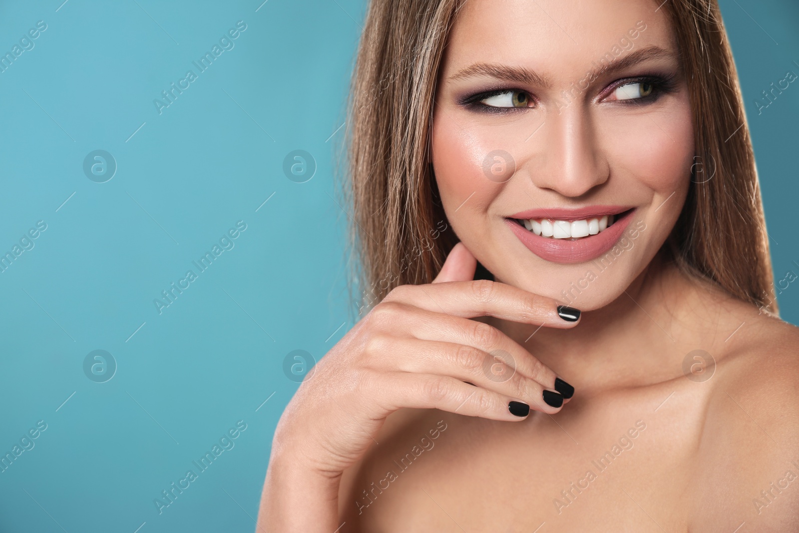 Photo of Beautiful woman with stylish nail polish on color background, space for text