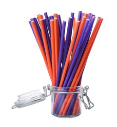 Color paper cocktail tubes in jar on white background