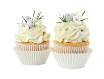 Photo of Tasty Easter cupcakes with vanilla cream isolated on white