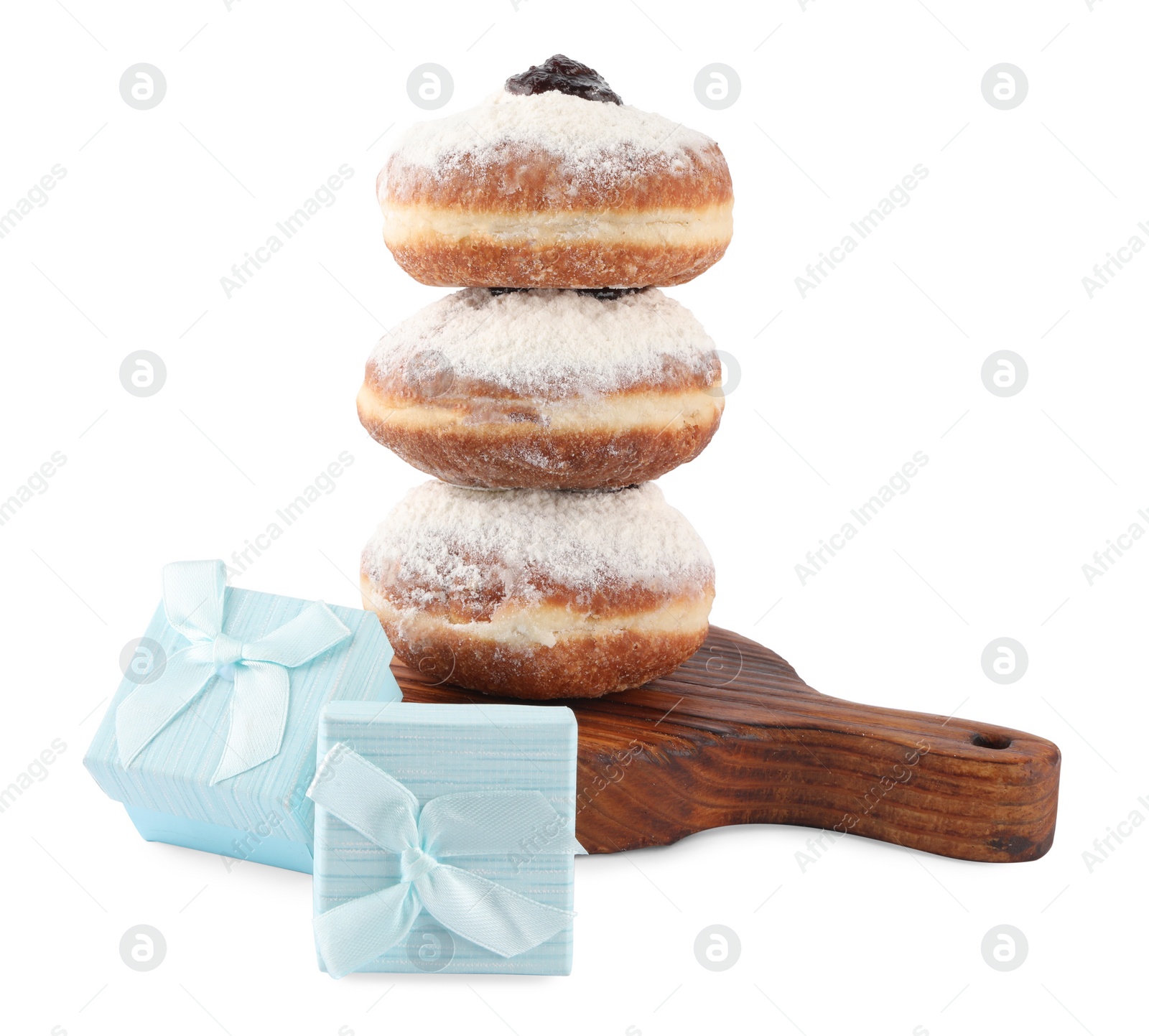 Photo of Hanukkah celebration. Gift boxes and donuts isolated on white