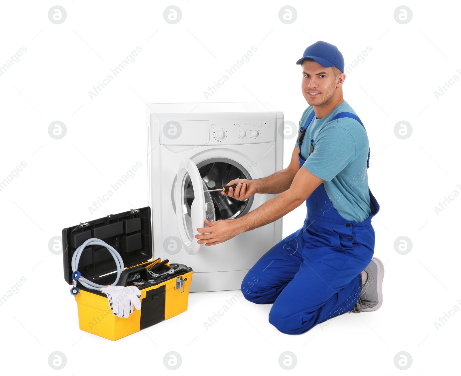 Photo of Plumber repairing washing machine on white background