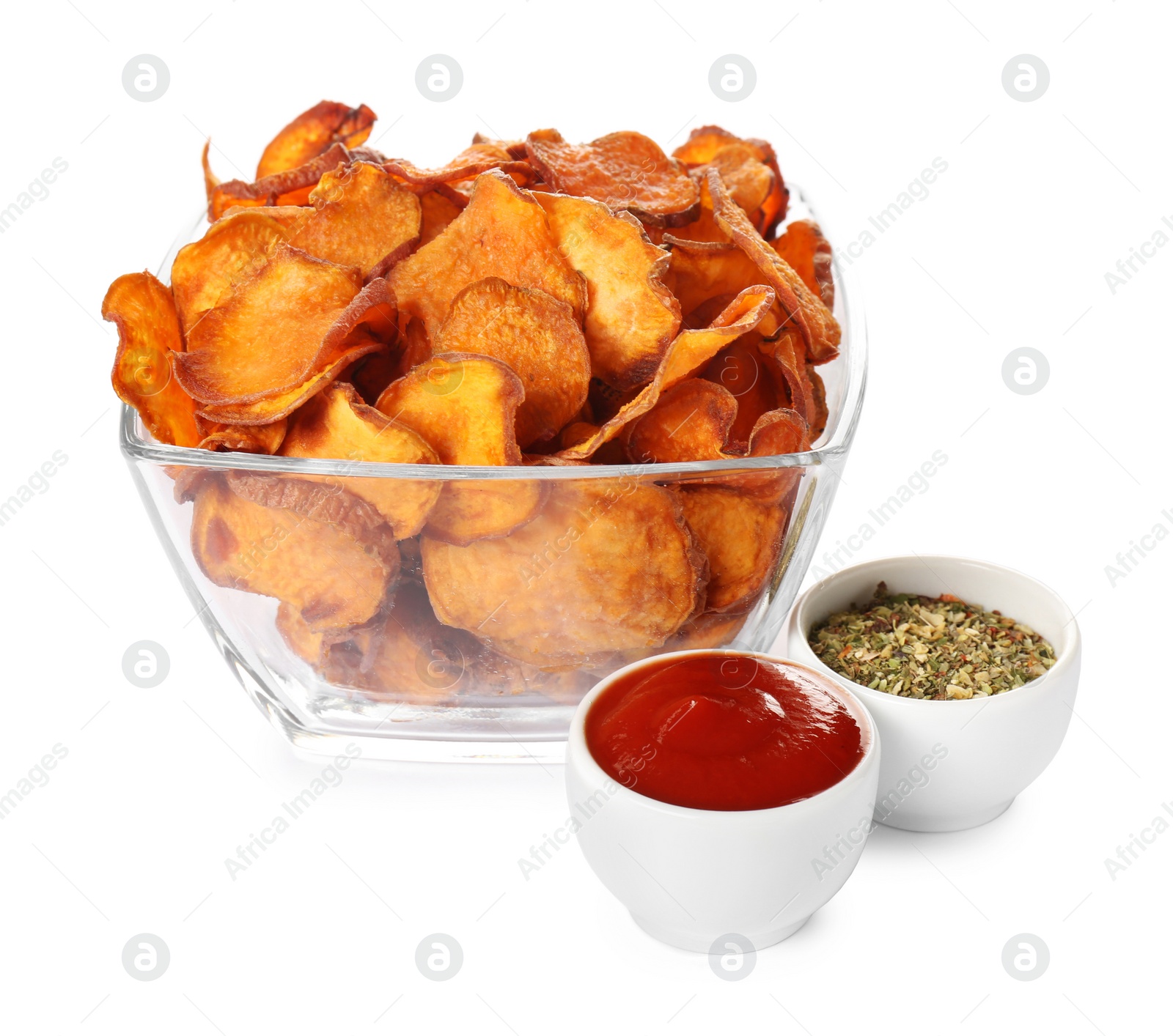 Photo of Bowl of sweet potato chips with sauce and herbs isolated on white