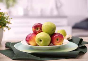 Photo of Ripe fresh apples on table