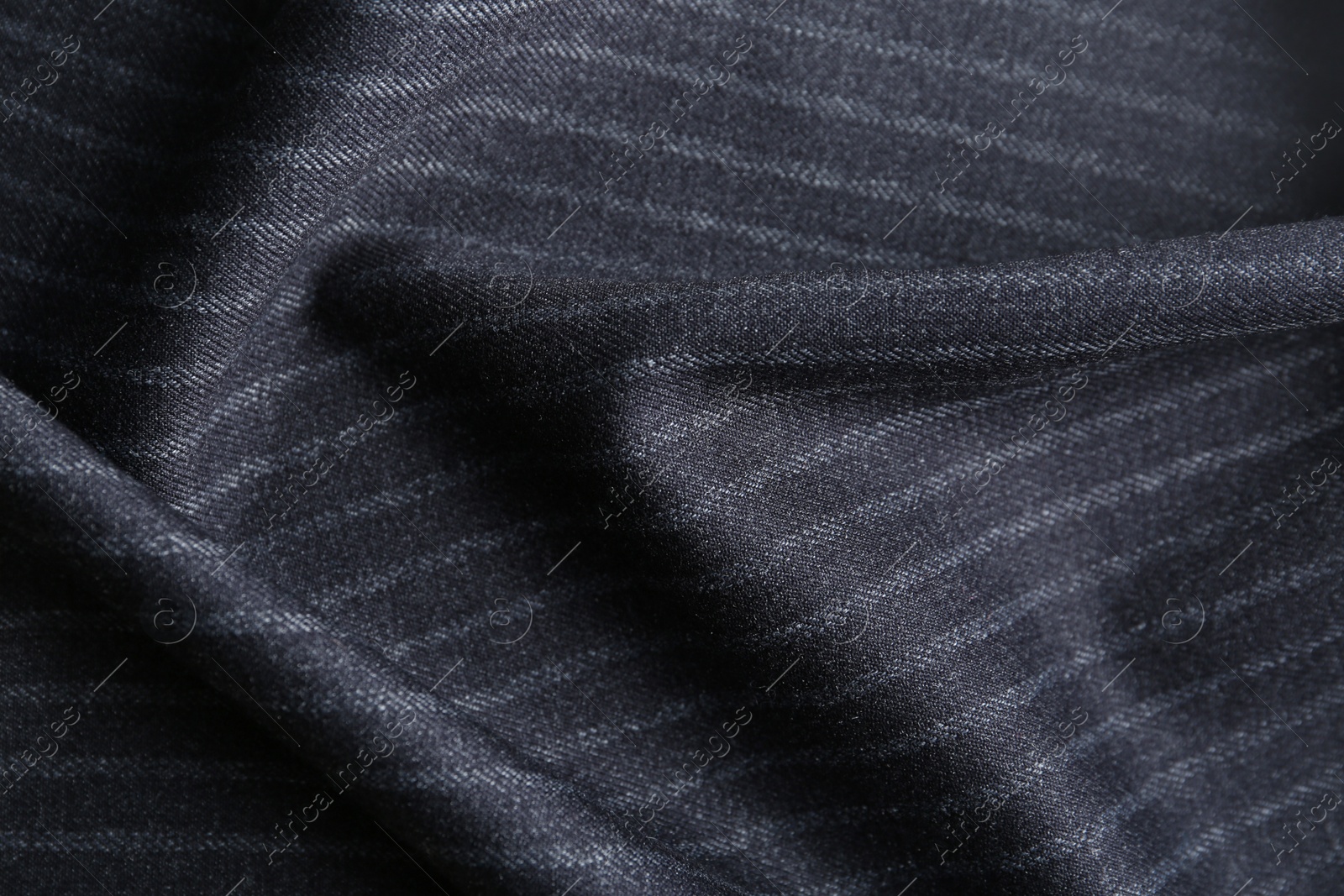 Photo of Texture of dark striped fabric as background, closeup