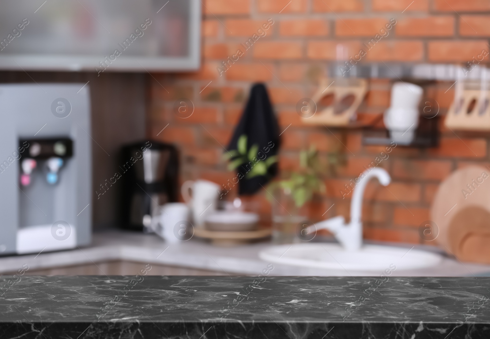 Photo of Countertop and blurred view of kitchen interior. Idea for home design