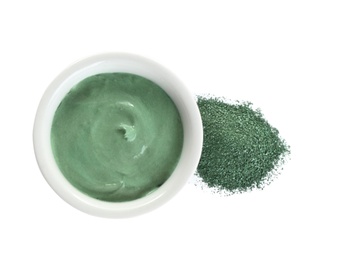 Freshly made spirulina facial mask in bowl and powder on white background, top view