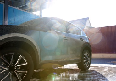 Photo of Clean wet automobile at professional car wash