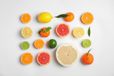 Photo of Different citrus fruits on white background, flat lay