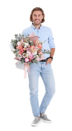 Photo of Young handsome man with beautiful flower bouquet on white background