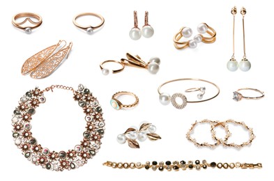 Set with golden rings, earrings, bracelets and necklace isolated on white