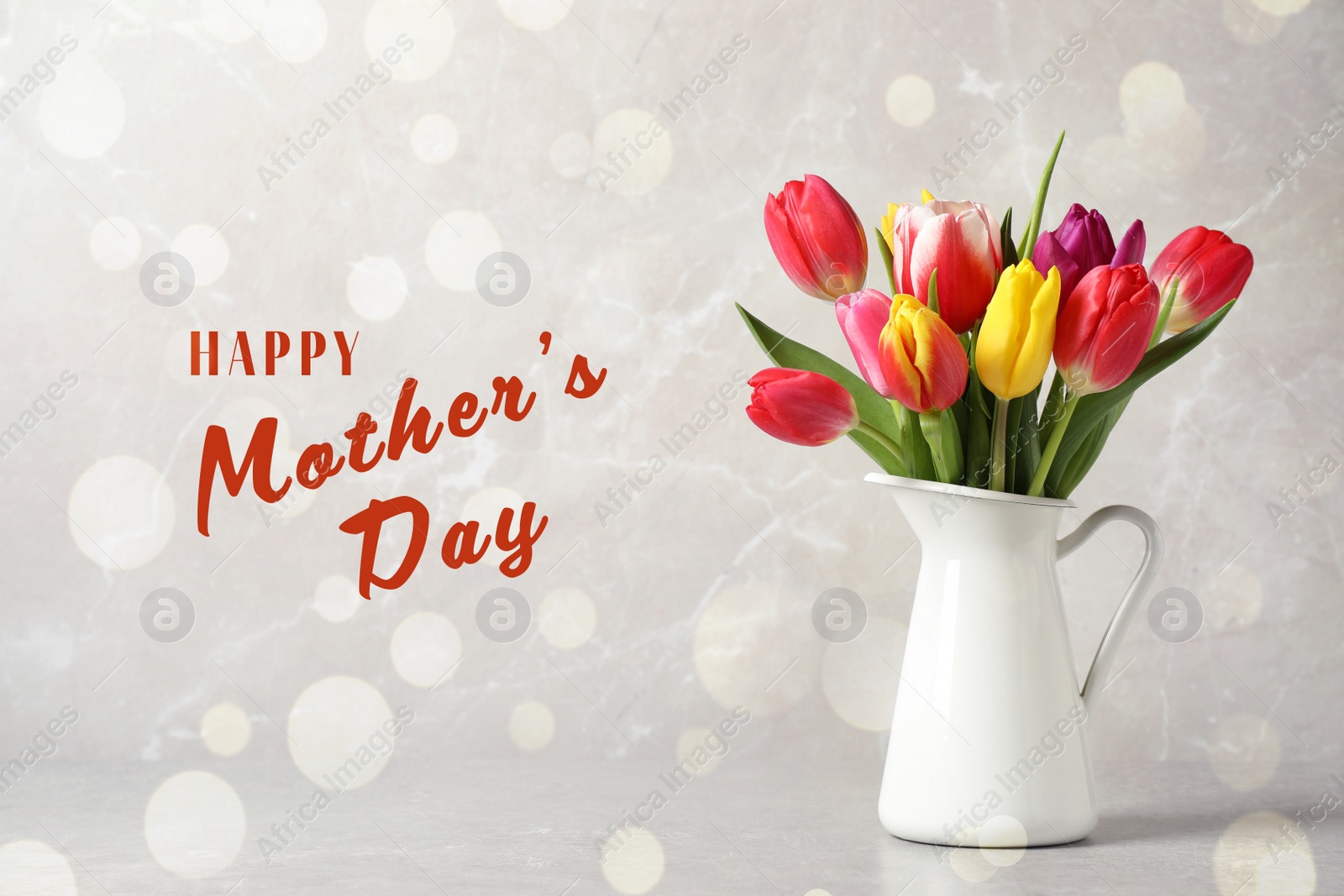 Image of Vase with beautiful tulips and phrase HAPPY MOTHER'S DAY on marble background