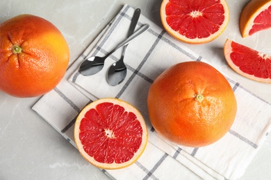 Photo of Flat lay composition with grapefruits on grey background