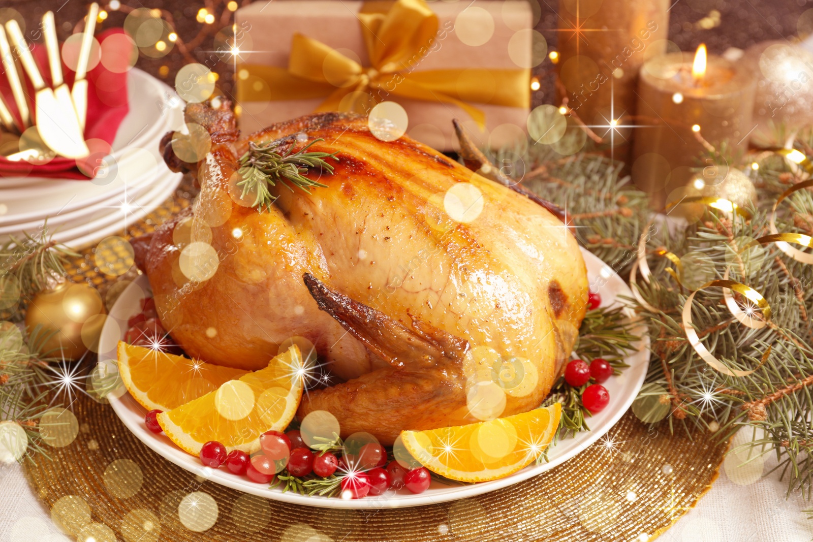 Image of Delicious roasted turkey served for Christmas dinner on table