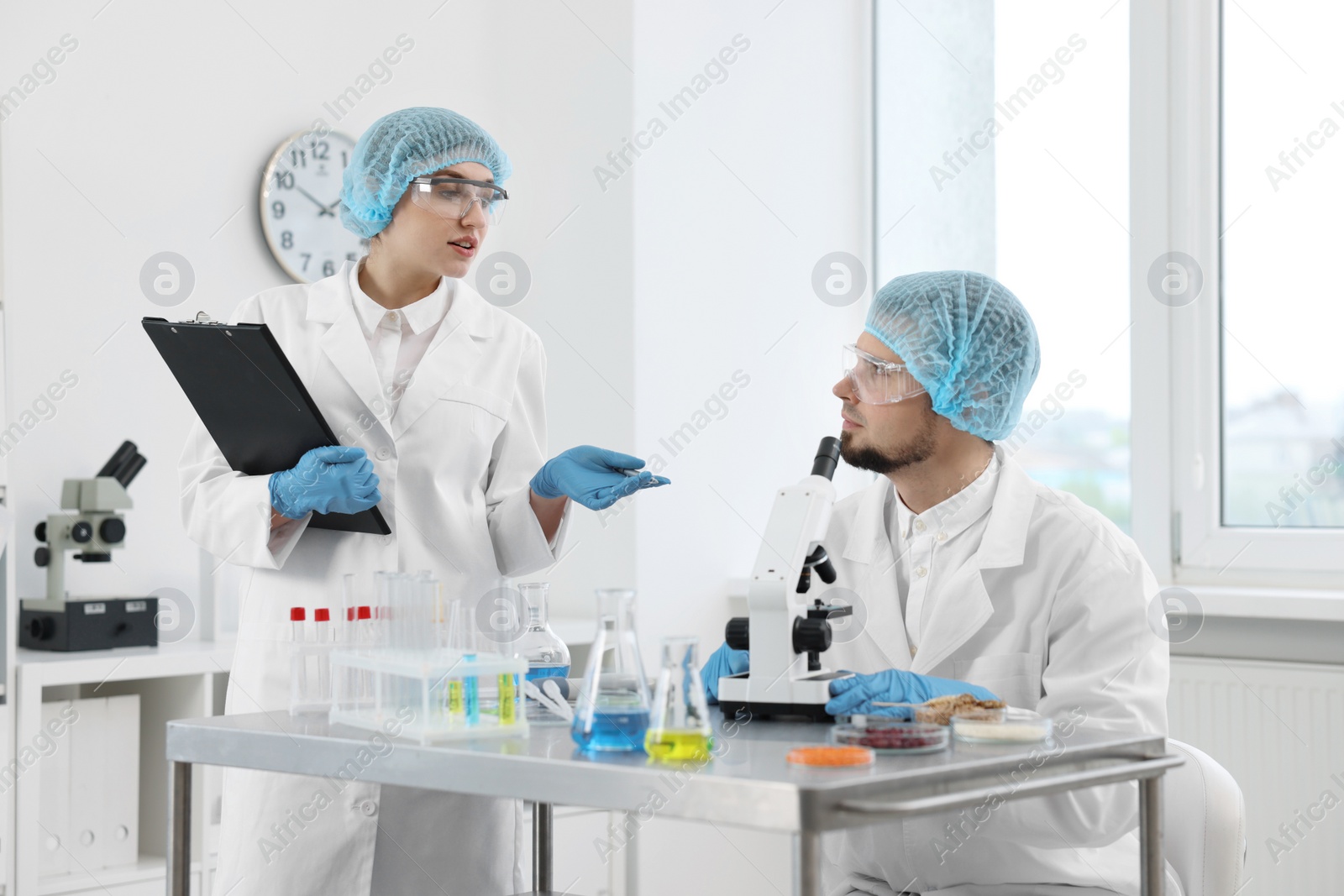 Photo of Quality control. Food inspectors checking safety of products in laboratory