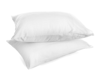 Photo of Clean soft bed pillows on white background