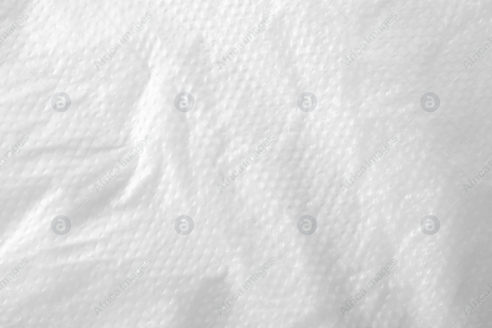 Photo of Texture of white plastic bag as background, closeup