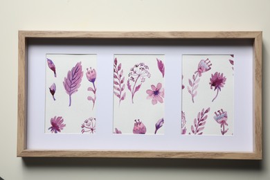 Frame with floral watercolor paintings on light background