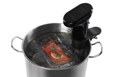 Photo of Thermal immersion circulator and vacuum packed salmon in pot on white background. Sous vide cooking