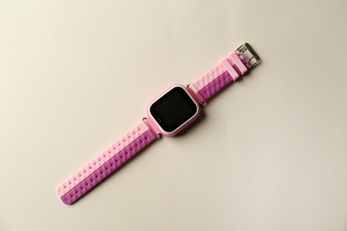 Photo of Trendy smart watch for kids on grey background, top view