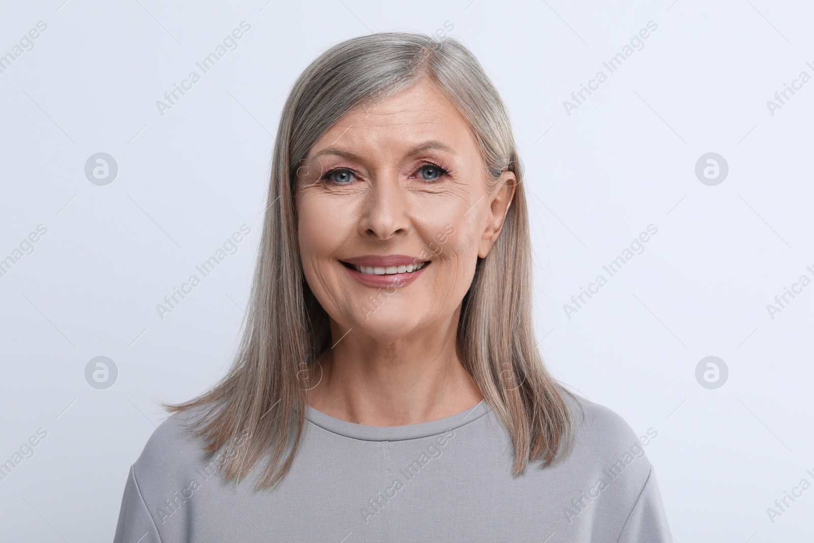 Photo of Portrait of beautiful senior woman on white background