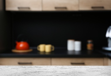 Image of White textured table in kitchen. Space for design