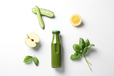 Photo of Flat lay composition with bottle of delicious detox juice and ingredients on light background