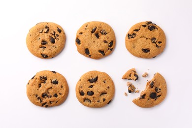 Delicious chocolate chip cookies on white background, flat lay