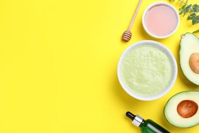 Photo of Homemade hair mask and ingredients on yellow background, flat lay. Space for text
