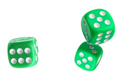 Three green dice in air on white background