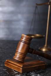 Photo of Law concept. Judge's gavel on dark table, closeup