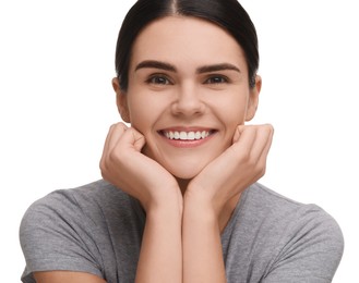 Young woman with clean teeth smiling on white background