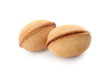 Photo of Delicious nut shaped cookies with boiled condensed milk on white background