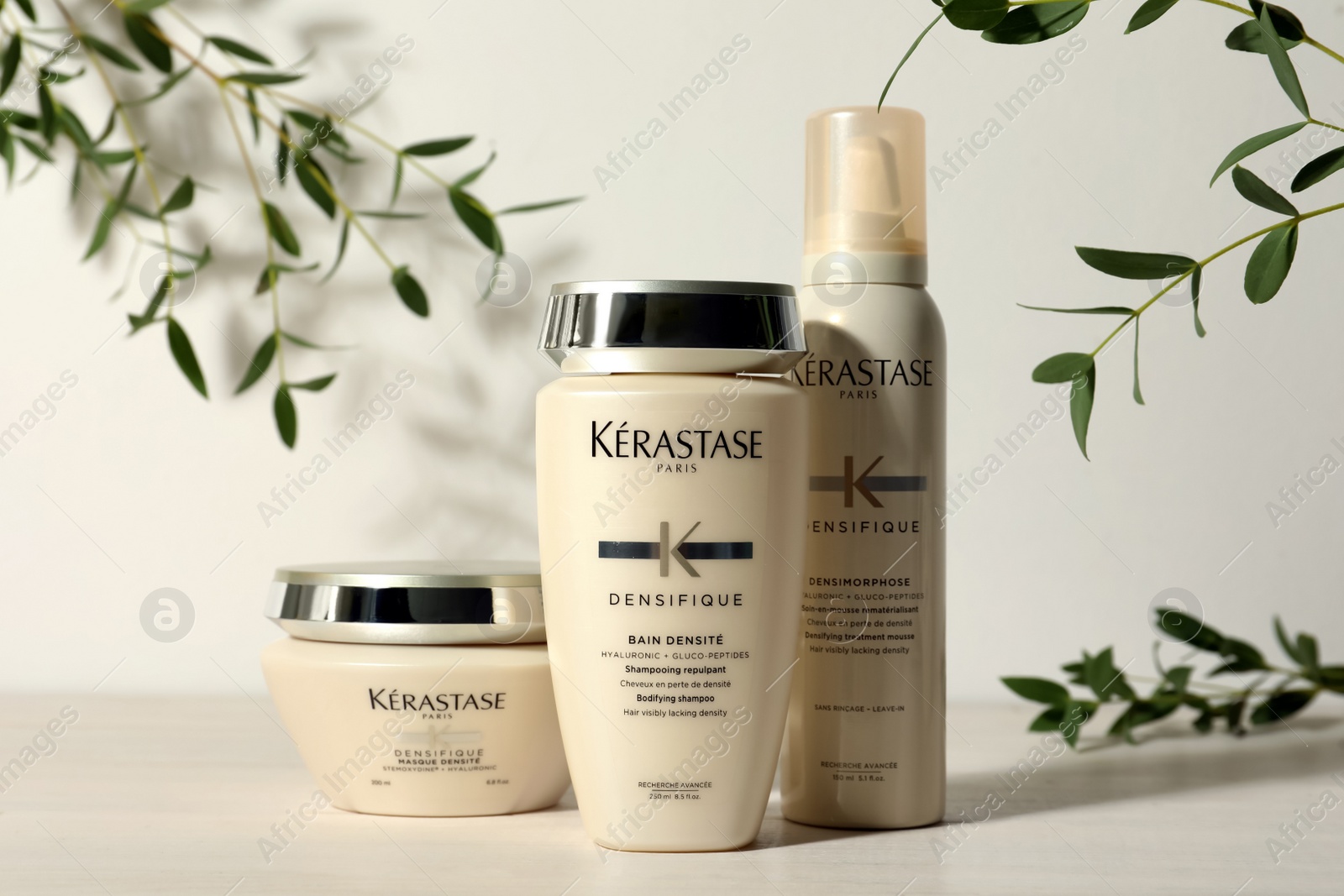 Photo of MYKOLAIV, UKRAINE - SEPTEMBER 07, 2021: Set of Kerastase hair care cosmetic products on white wooden table