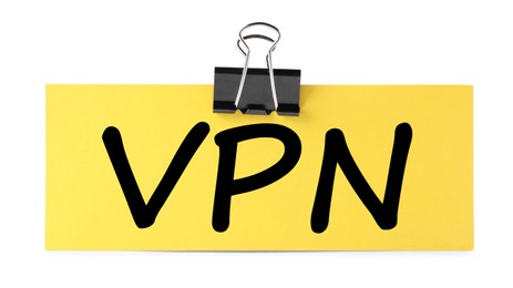 Photo of Paper note with acronym VPN (Virtual Private Network) isolated on white