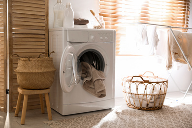 Stylish room interior with washing machine. Design idea