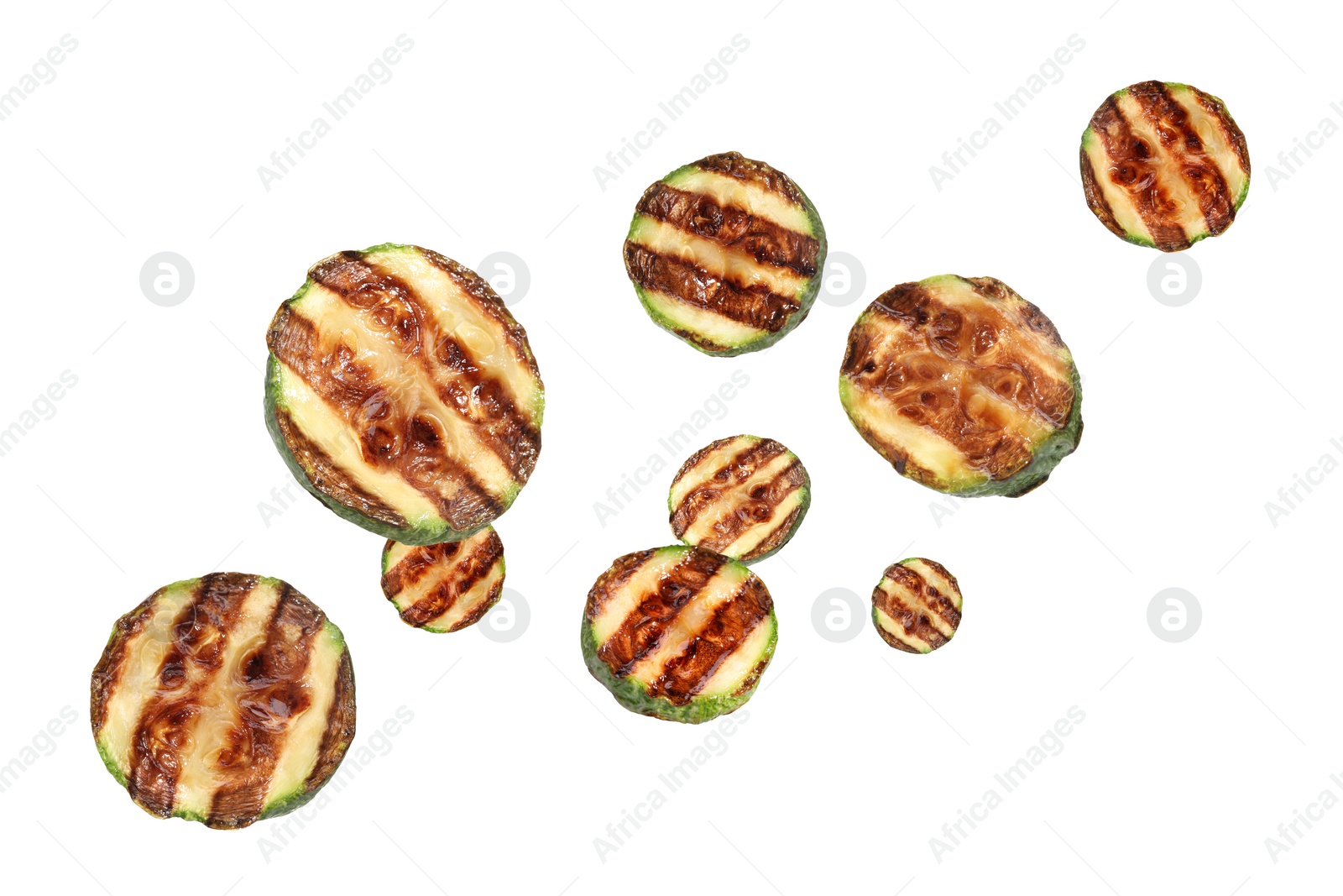 Image of Slices of grilled zucchinis in air on white background