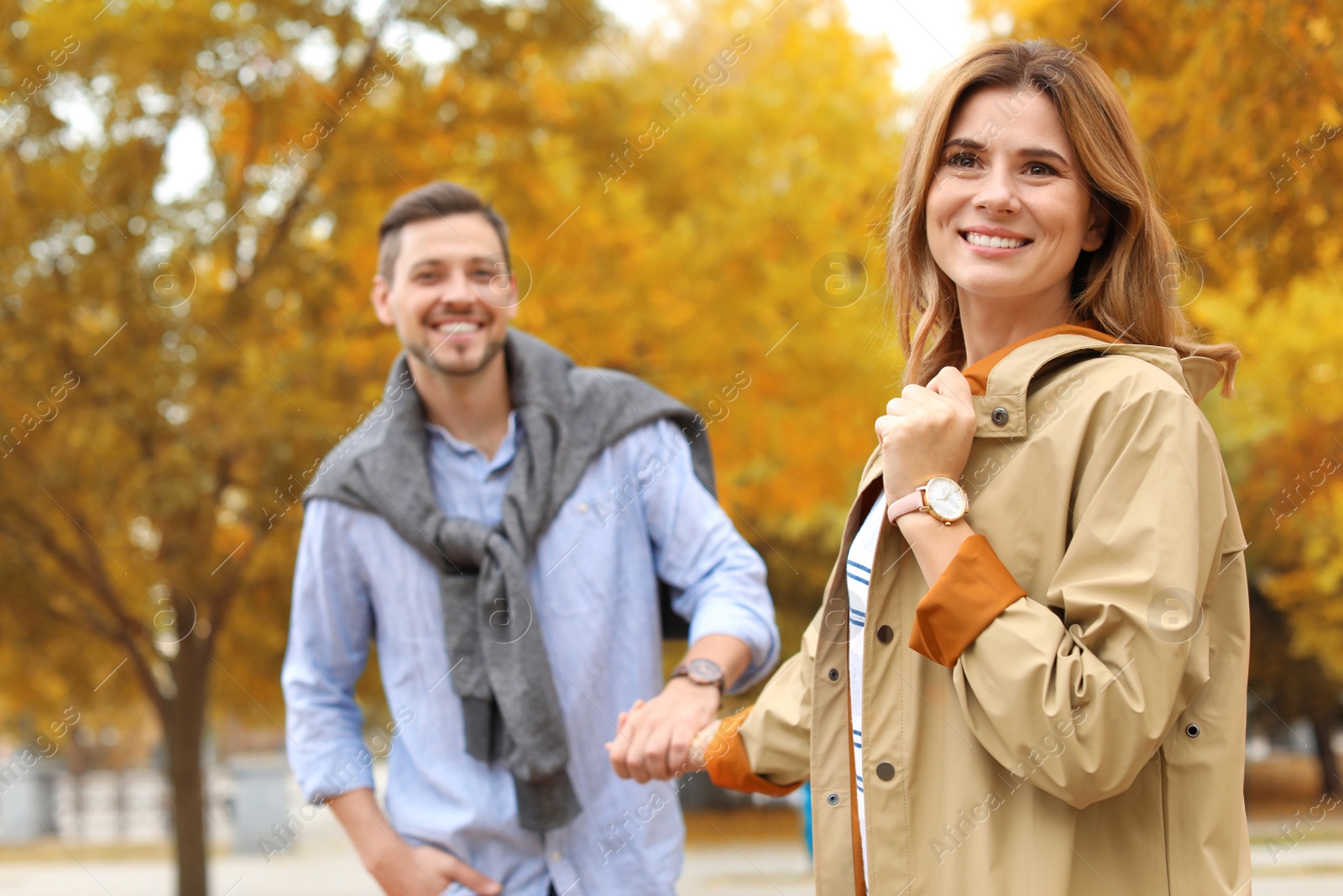 Photo of Lovely couple spending time together in park. Autumn walk