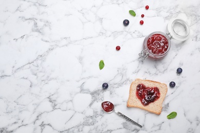 Photo of Toast with jam and berries on light background, top view