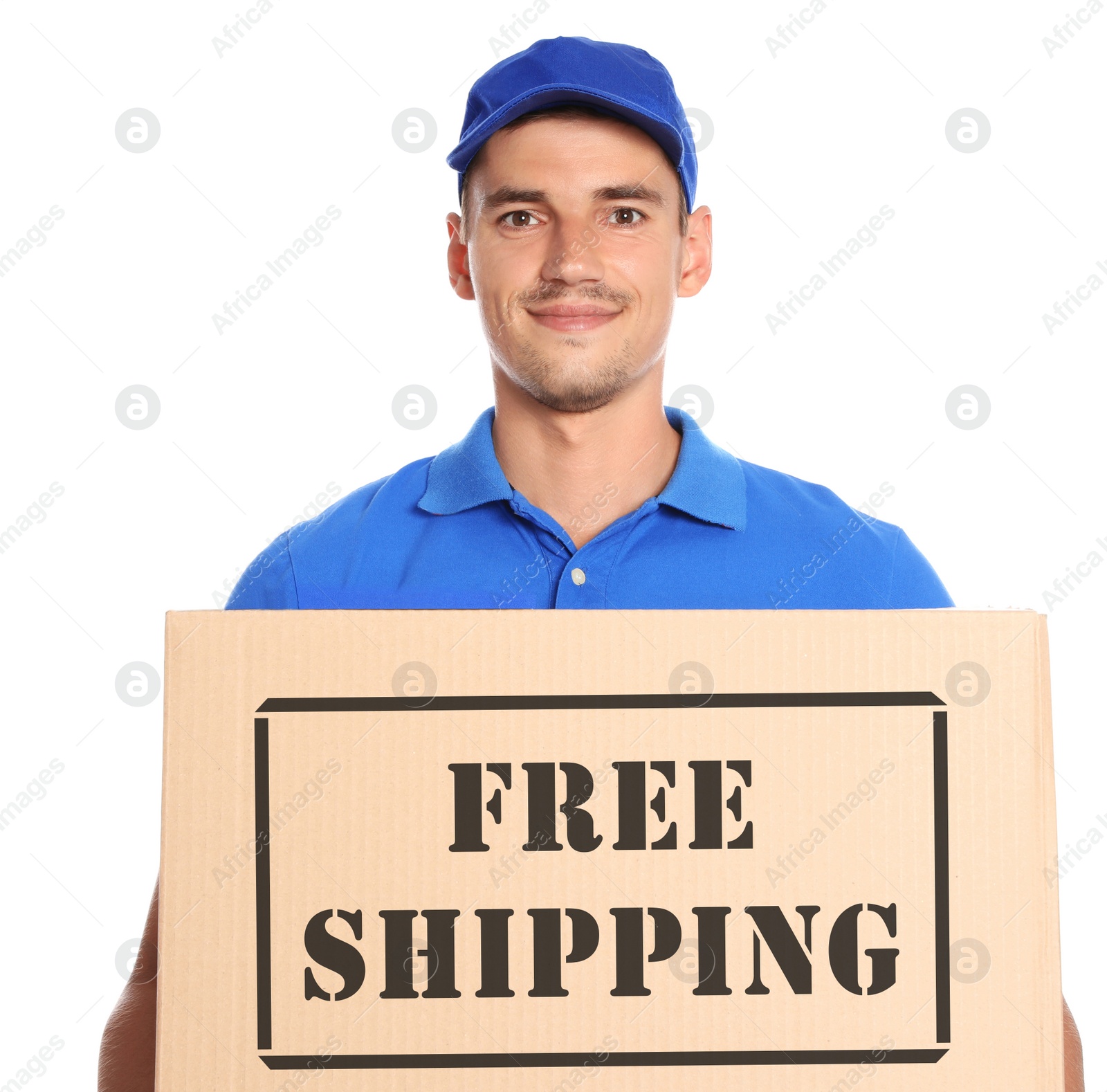 Image of Happy young courier with cardboard box on white background. Free shipping