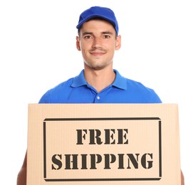 Image of Happy young courier with cardboard box on white background. Free shipping
